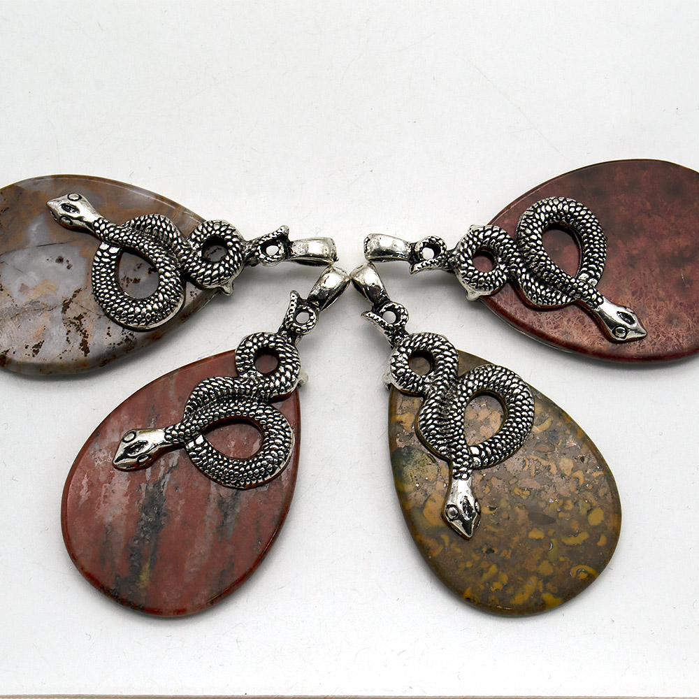 Фото товара кулон из яшмы "змея на камне" 68*35 мм