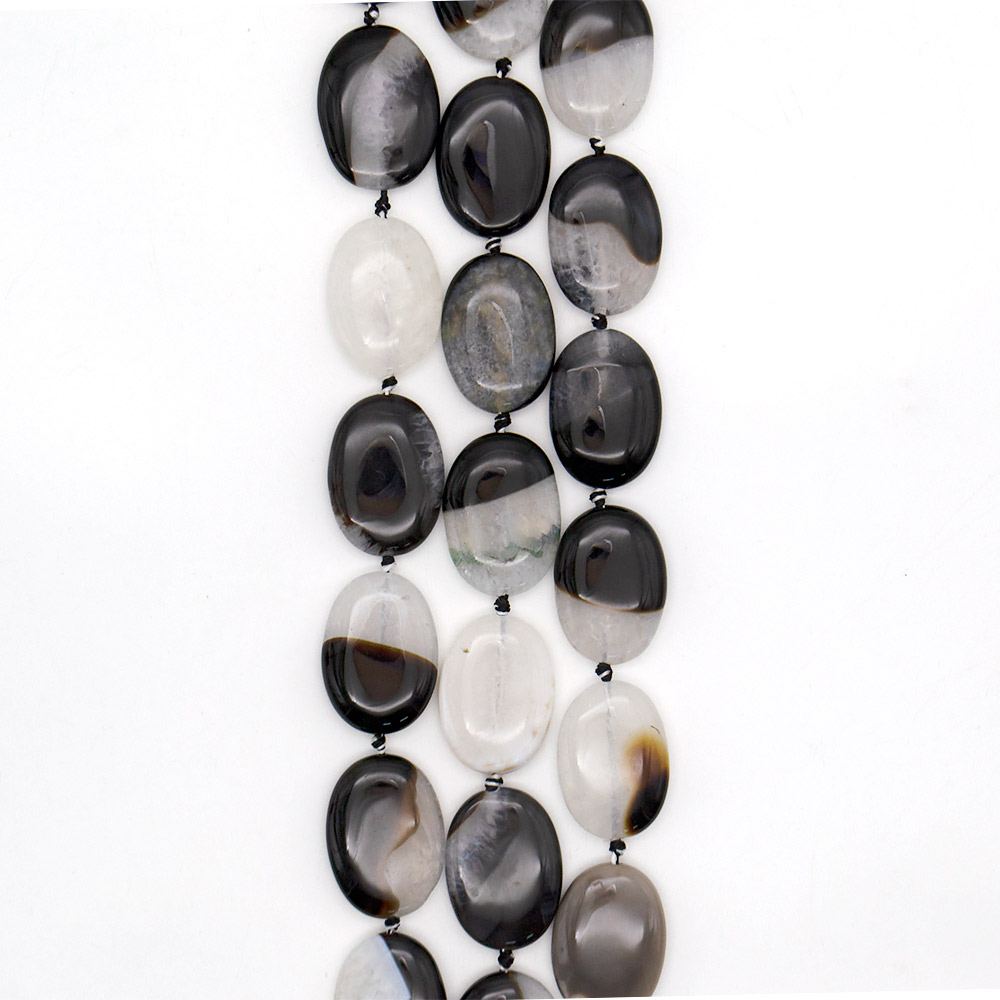 Фото товара агат черный с кварцем белым таблетка 35*25 мм