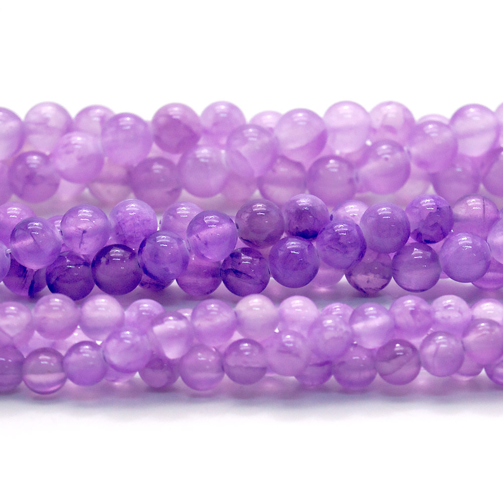 Фото товара кальцит тонированый цвет аметист шар