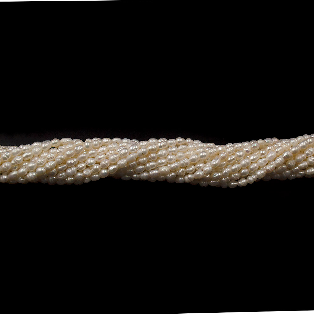Фото товара жемчуг белый "рис" 4*3 мм