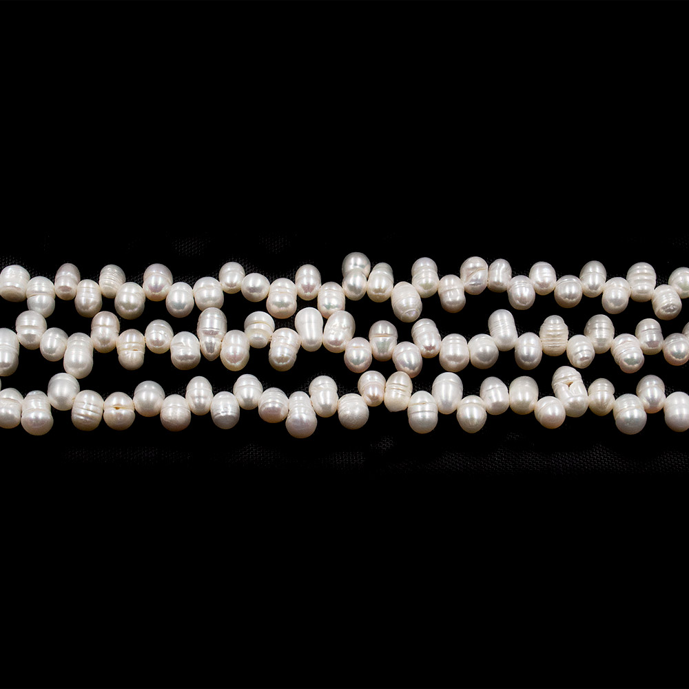 Фото товара жемчуг белый "рис" горизонтальный 7*4 мм