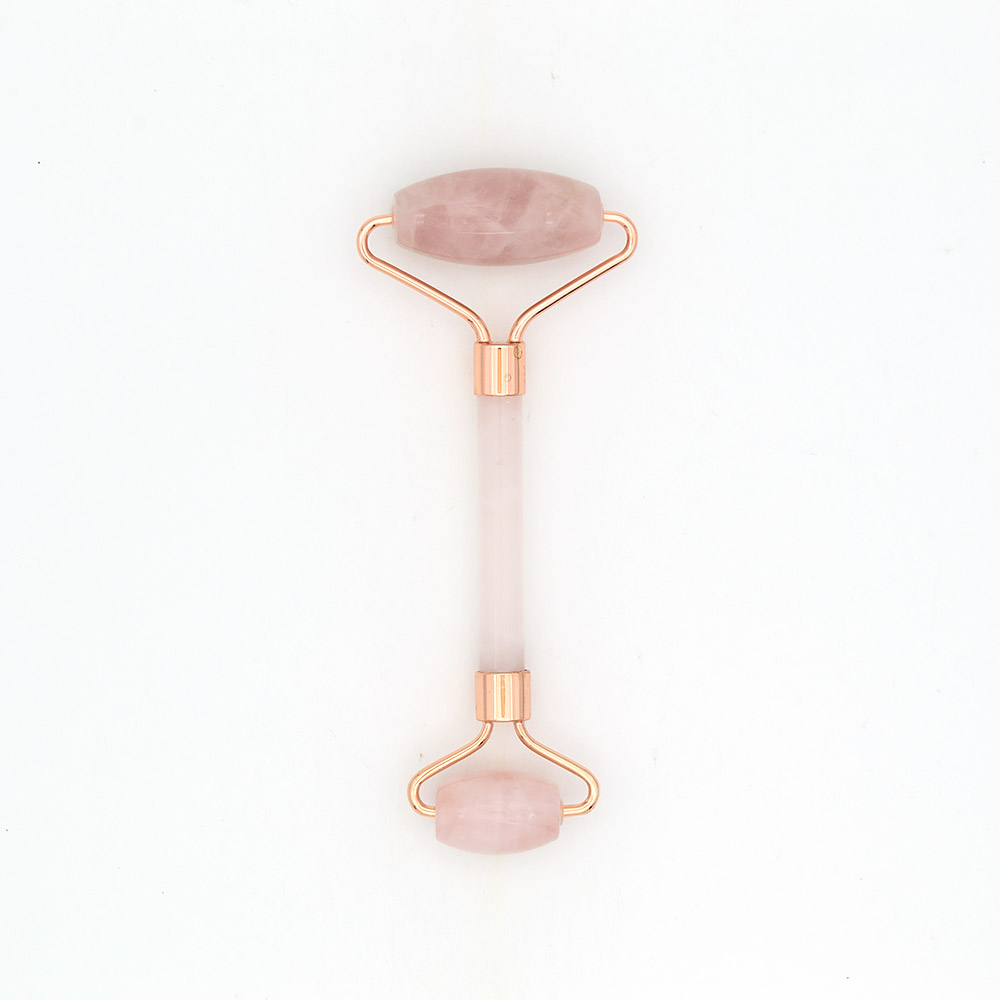 Фото товара массажер роликовый из розового кварца с ручкой из розового кварца