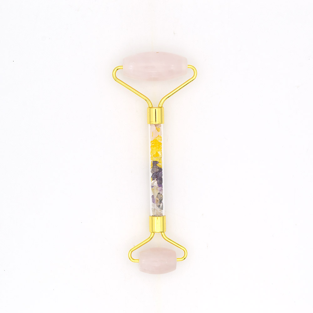 Фото товара массажер роликовый из розового кварца с ручкой из самоцветов