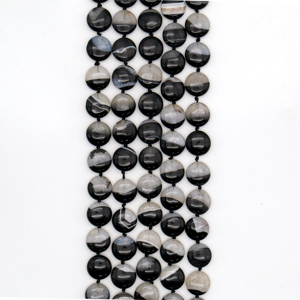 Фото товара агат черный с кварцем белым таблетка 18 мм