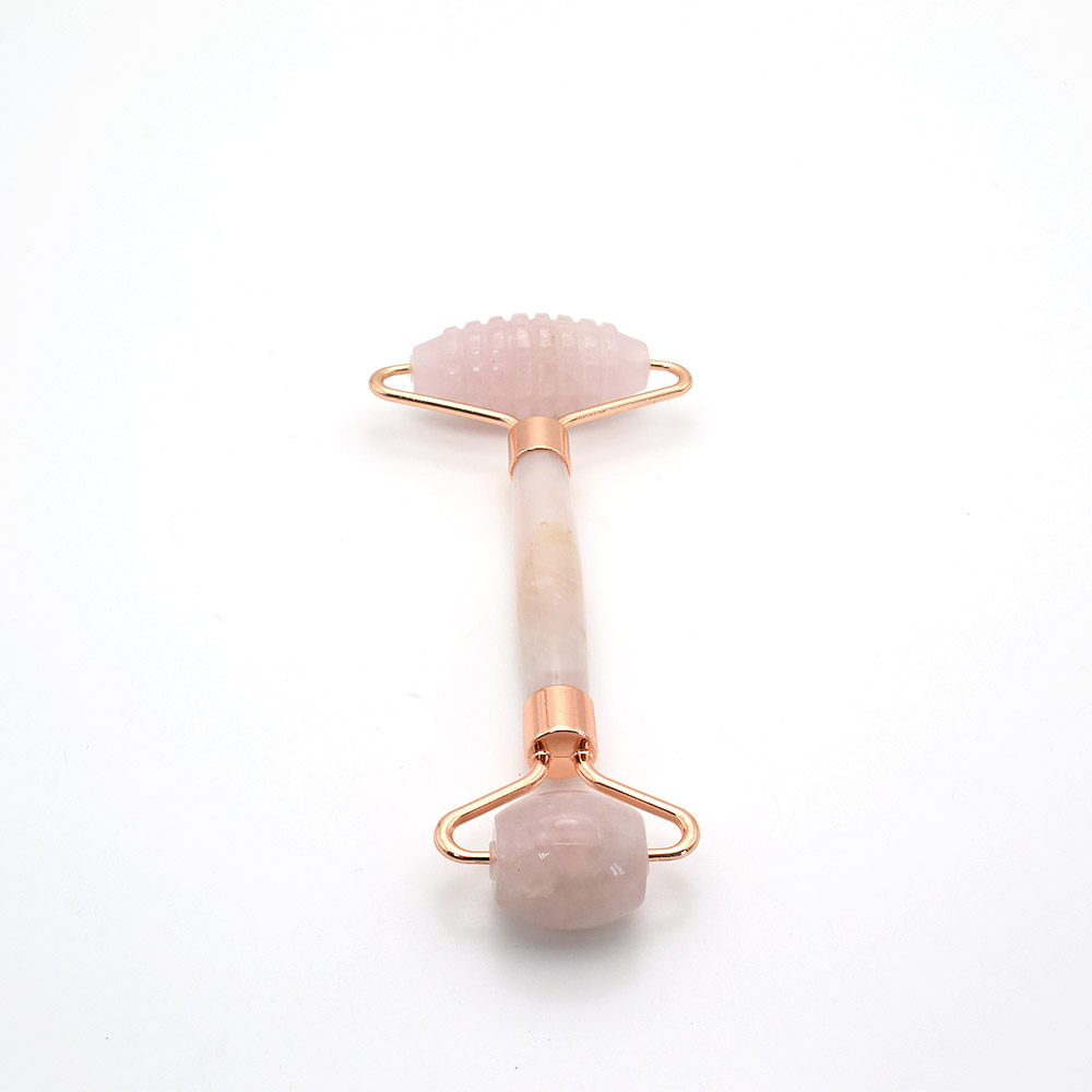 Фото товара массажер роликовый с шипами из розового кварца с ручкой из розового кварца