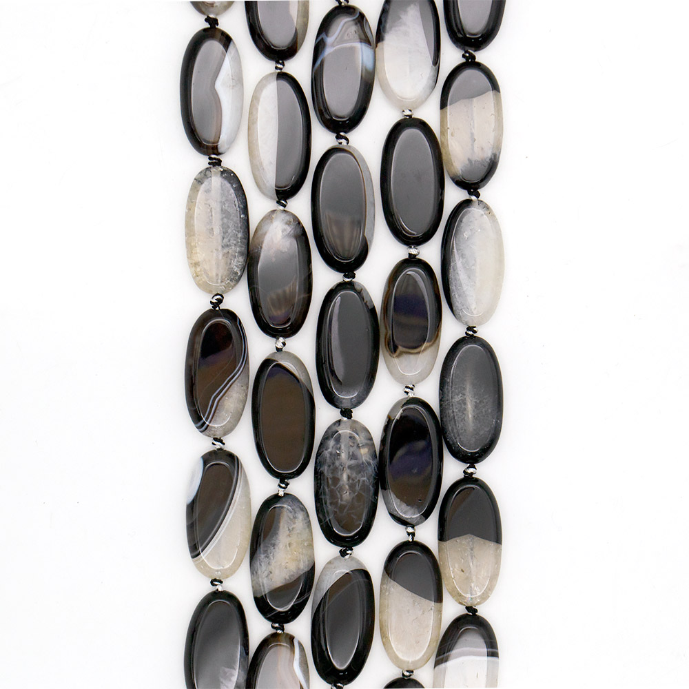 Фото товара агат черный с кварцем белым таблетка 40*20 мм