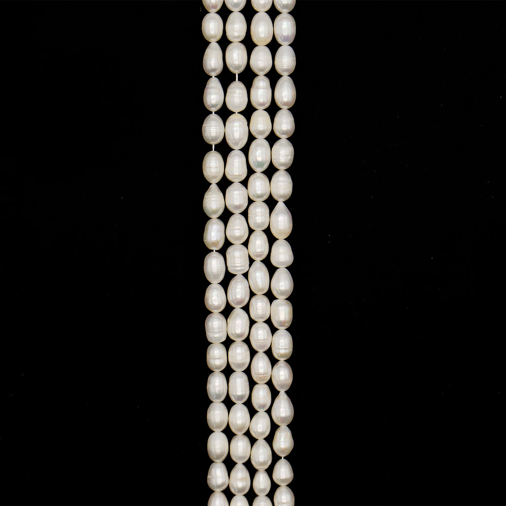 Фото товара жемчуг белый "рис" 15*10 мм