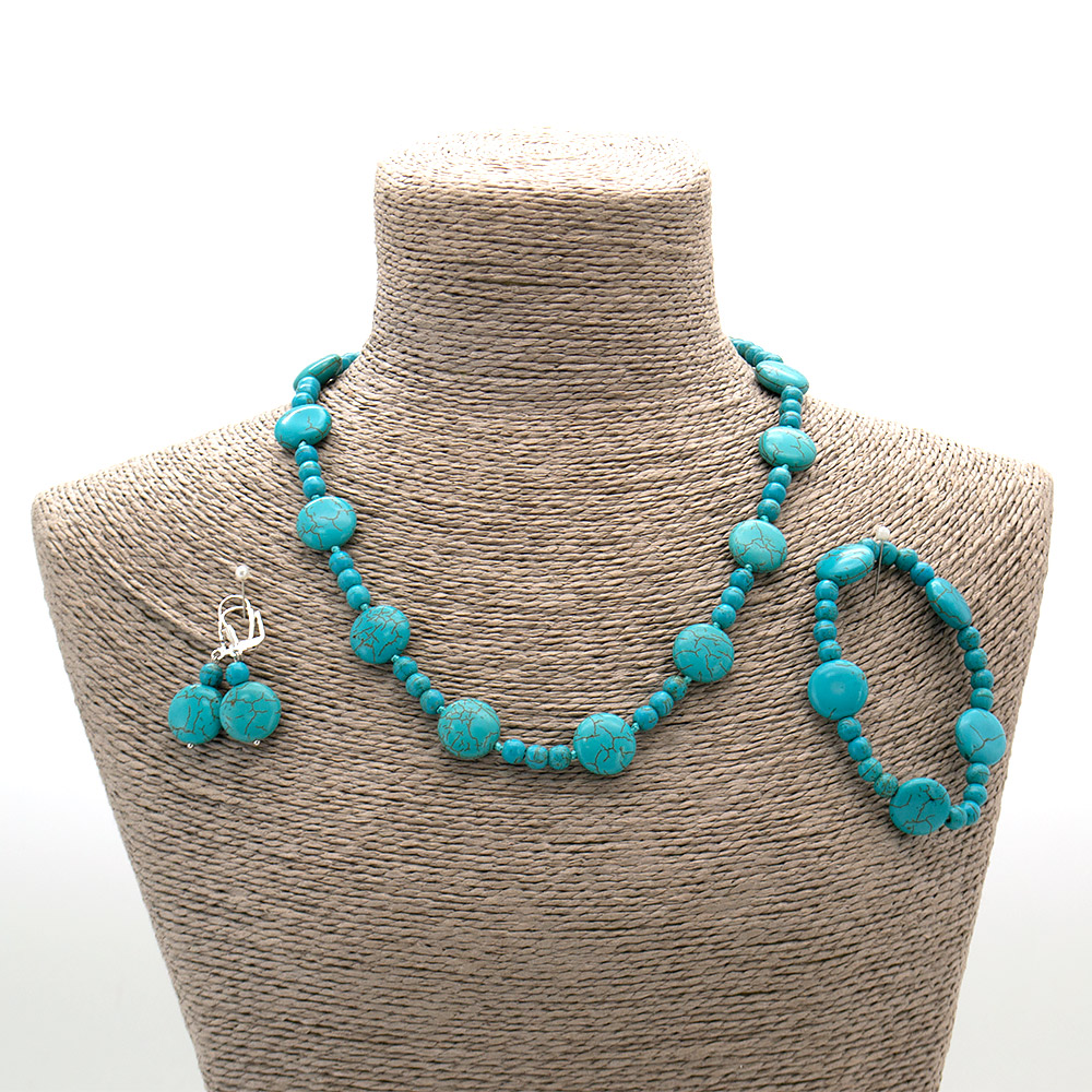 Фото товара бусы,браслет,серьги из говлита тонированного таблетка круглая