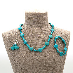 Бусы,браслет,серьги из говлита тонированного таблетка круглая