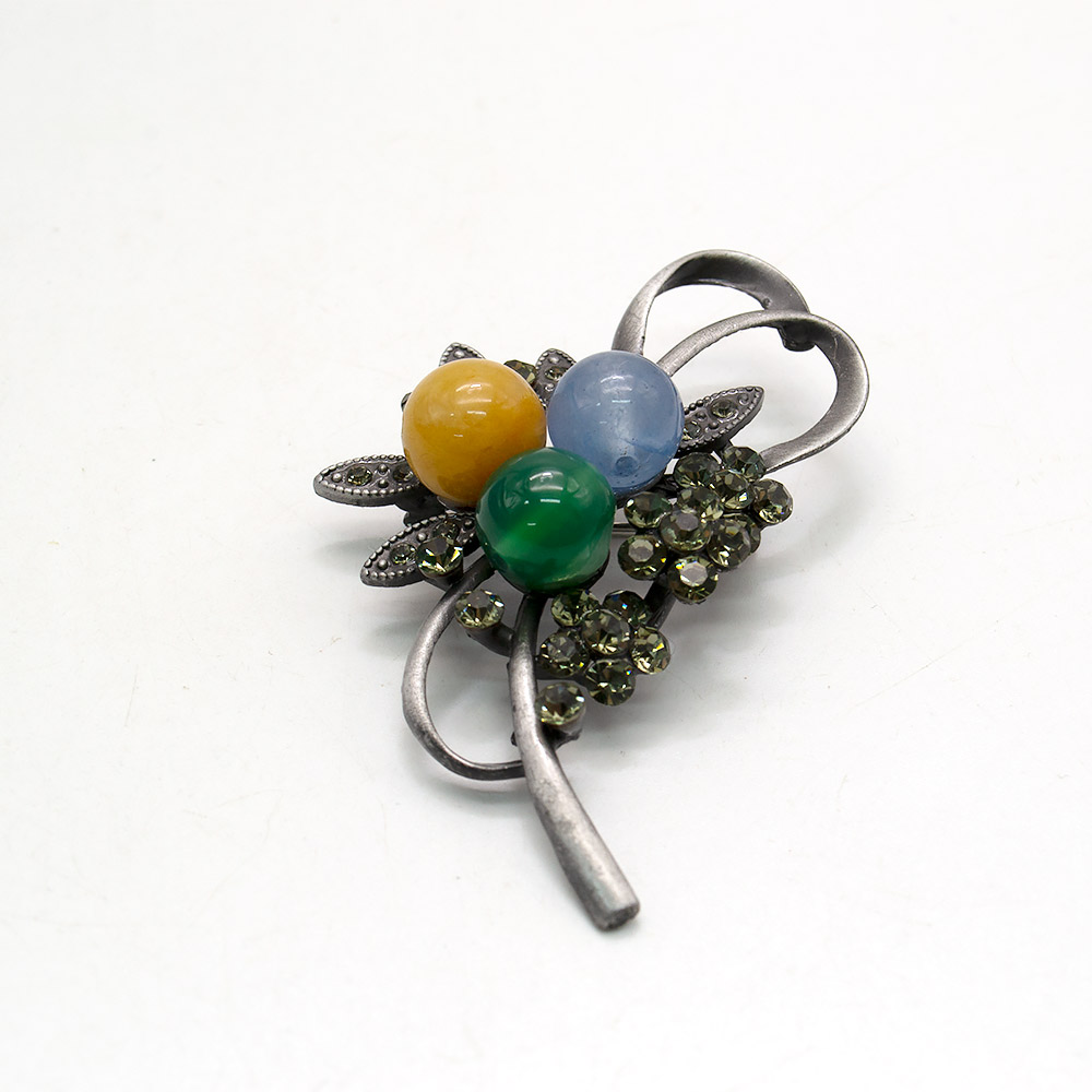 Фото товара брошь "бант 3 кольца" микс камней а0101