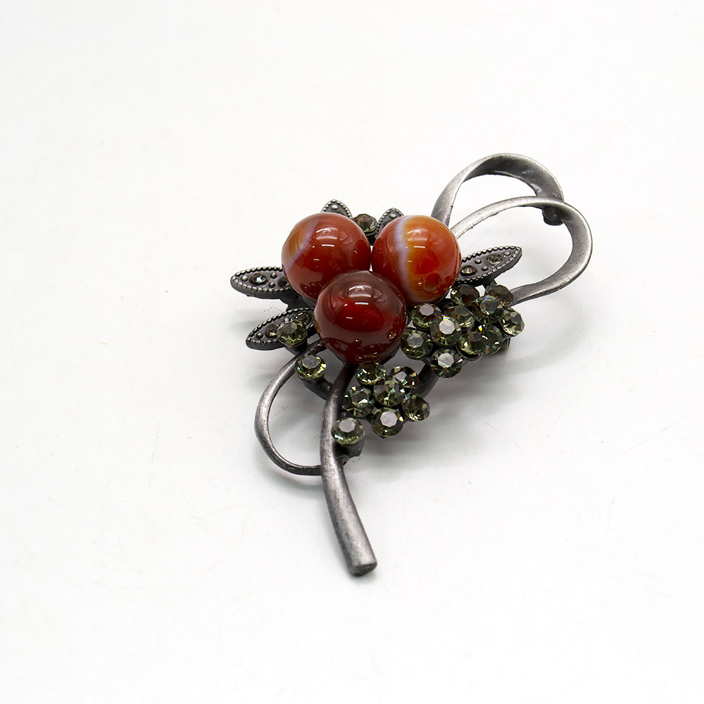 Фото товара брошь "бант 3 кольца" сердолик а0101